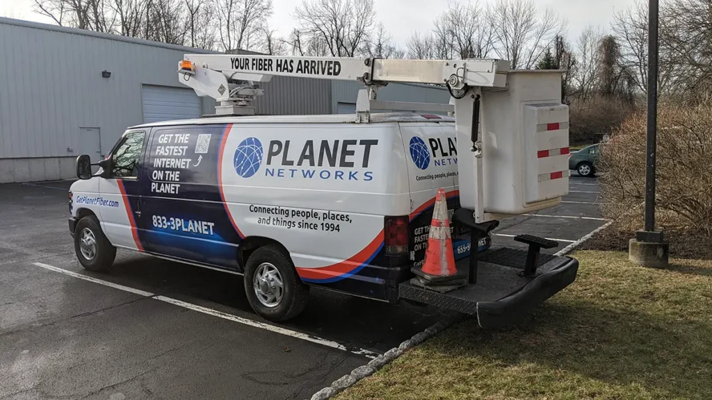 Planet Networks bucket truck with coordinated fleet graphics