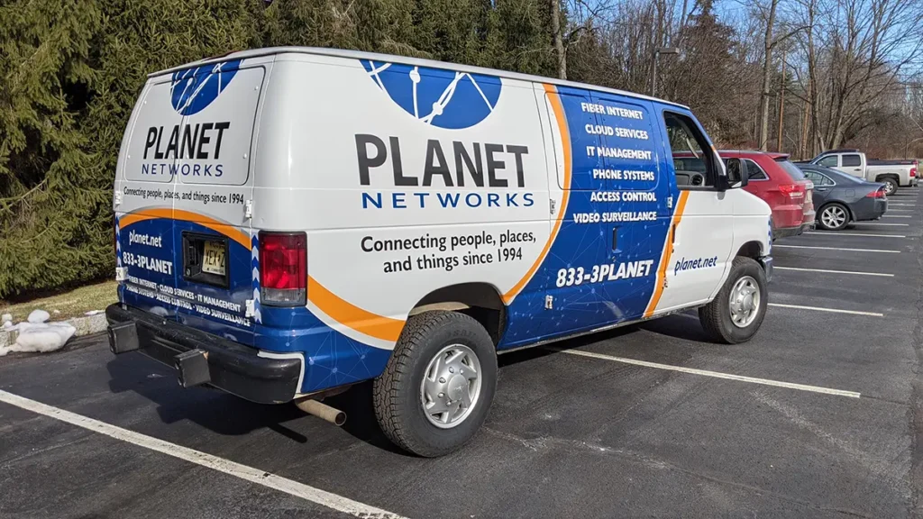 Planet Networks cargo van with commercial vehicle graphics
