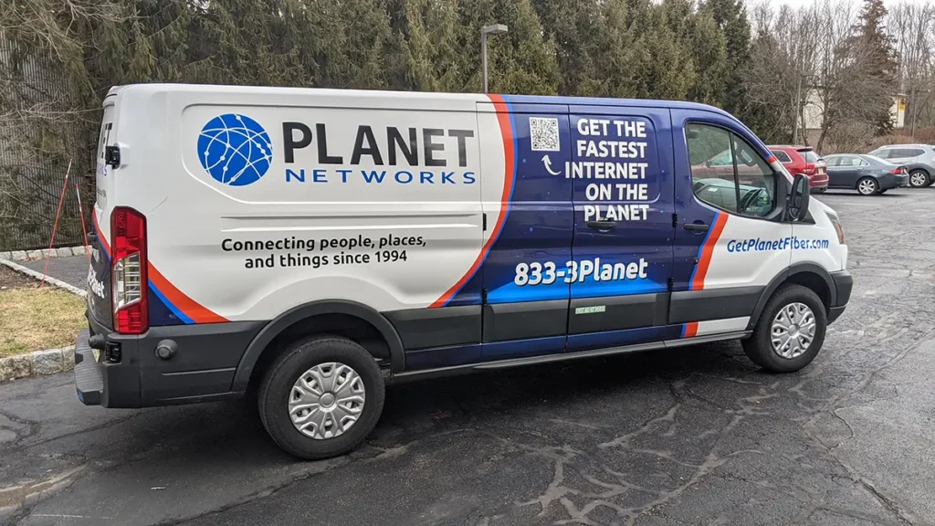 Planet Networks Ford Transit van with commercial fleet graphics