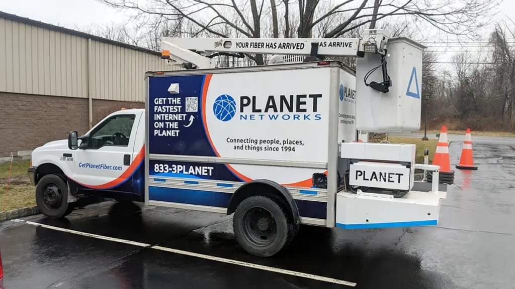 Planet Networks splicer bucket truck with coordinated fleet graphics