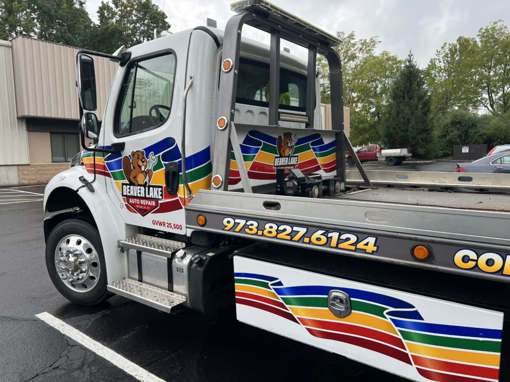 Beaver Lake Auto Repair rollback tow truck with printed and cut vehicle lettering in Franklin NJ