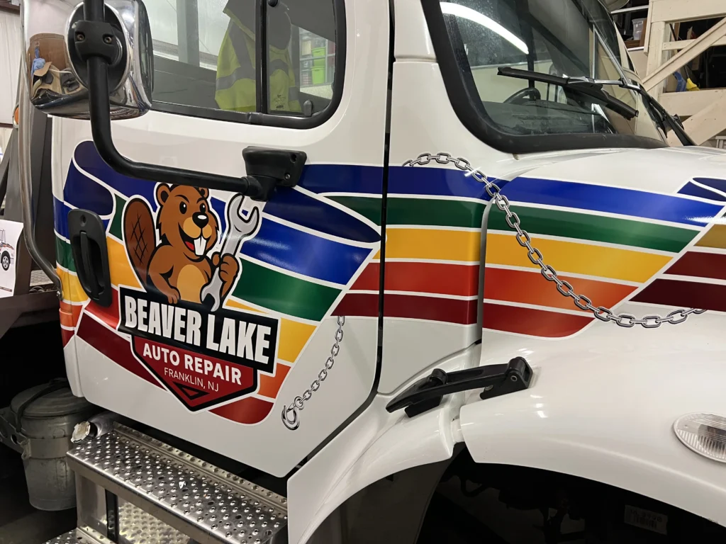 Beaver Lake Auto Repair rollback tow truck with printed and cut vehicle lettering in Franklin NJ