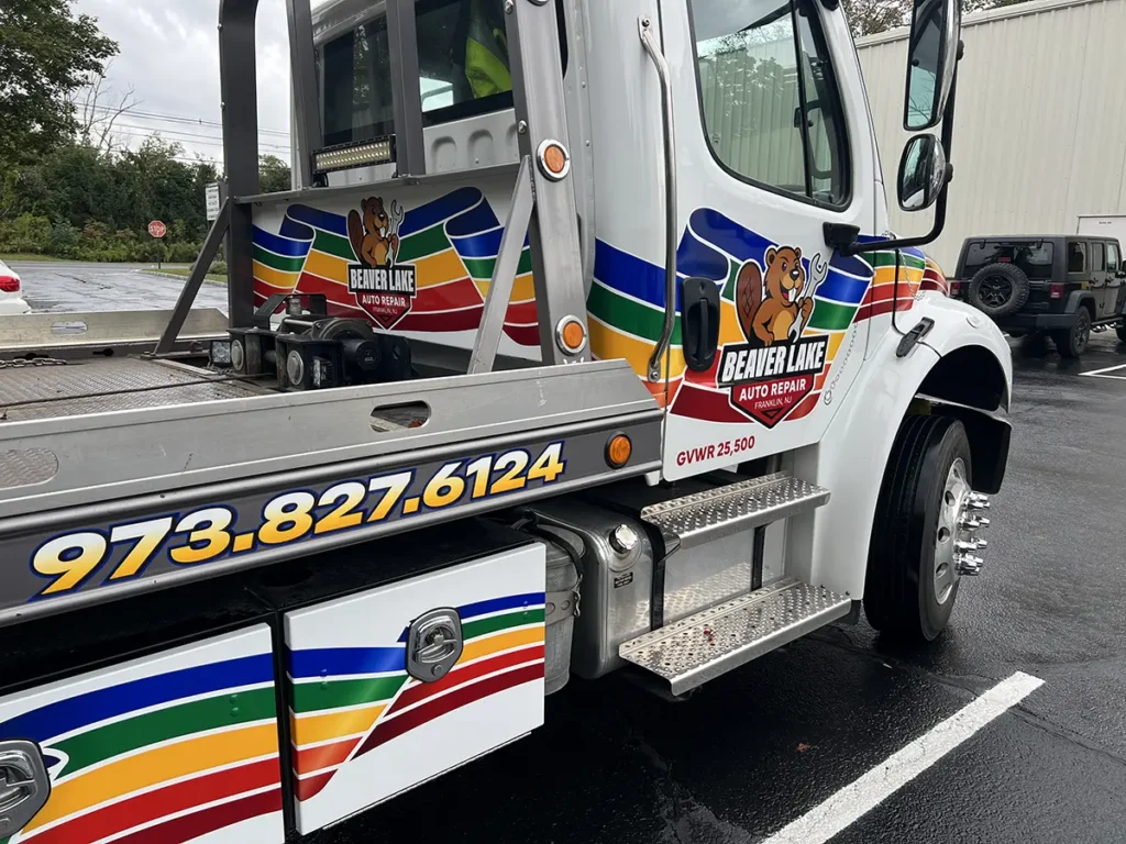 Beaver Lake Auto Repair rollback tow truck with printed and cut vehicle lettering in Franklin NJ