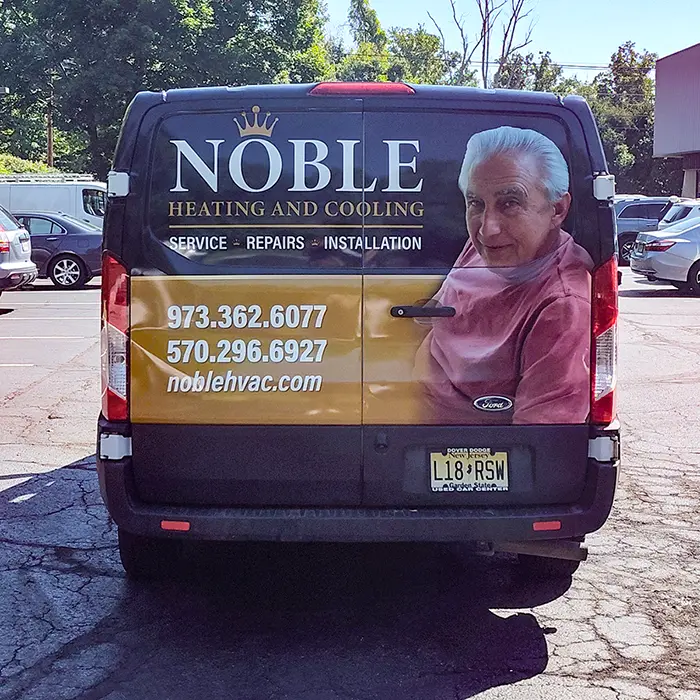 Rear view of Noble Heating and Cooling Ford Transit wrap with personal photo detail